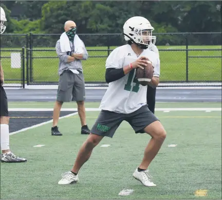  ?? PAUL DICICCO — FOR THE NEWS-HERALD ?? Senior quarterbac­k Michael Huss drops back to pass during Mayfield’s first football practice Aug. 4.