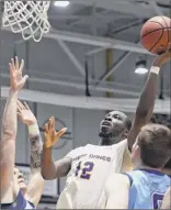  ?? Jenn March / Special to the Times Union ?? Ualbany guard Devonte Campbell takes a shot Saturday among Maine defenders. Campbell scored nine points on 3-for-6 shooting from the field.