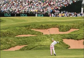  ?? CHARLIE RIEDEL / AP ?? Justin Thomas hits a 3-wood to the 18th green at Erin Hills, setting up a short eagle putt that enabled him to tie a U.S. Open record with a 63 in the third round. Alas, he shot a final-round 75 and tied for ninth.