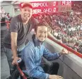  ??  ?? Journalist Surasak Marktavee, left, and rock star Artiwara ‘Toon Body Slam’ Kongmalai at Anfield in 2013.