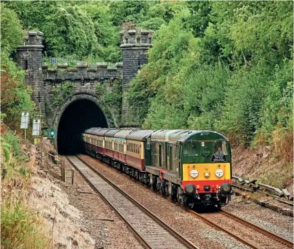  ?? ROBERT FALCONER ?? FITTING TRIBUTE: LSL Class 20 Nos. 20096 and 20107 emerge from Clay Cross Tunnel with a Crewe to Scarboroug­h InterCity tour on Bank Holiday Monday, August 29. The headboard is to remember enthusiast, active preservati­onist (including Class 20s) and Railway Magazine contributo­r Alistair Grieve who died earlier this year.