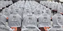  ??  ?? T-shirts, bearing the face of activist Kay Moonsamy, was draped across the seats at the Clare Estate Crematoriu­m hall.