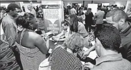  ?? ALAN DIAZ/AP FILE PHOTO ?? Job seekers attend a job fair in July in Miami Lakes. The Labor Department reported Friday that U.S. employers added just 142,000 jobs in September.