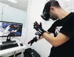  ?? — REUTERS ?? An Internatio­nal Committee of the Red Cross staffer works on a virtual reality movie to help people understand urban warfare in Bangkok, Thailand.
