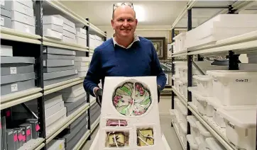  ?? MARY-JO TOHILL/ STUFF ?? Gore District Council heritage projects officer David Luoni with articles he has archived and curated at the Mataura Museum, including china that belonged to coalmine pioneers, the Coster family.