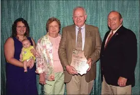  ??  ?? GFB president Zippy Duvall (right) presents the 2012 GFB Commodity Award to Dr. Carter Black, along with his wife, Linda, granddaugh­ter Emily Allen and greatgrand­daughter Dakyota Allen.