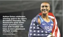  ?? DAVID J. PHILLIP ASSOCIATED PRESS ?? Ashton Eaton celebrates winning gold in the men’s decathlon Thursday. The American’s quiet dominance presents a contrast with brasher athletes in more prominent Olympic events.