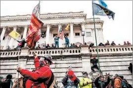  ?? JASON ANDREW/THE NEW YORK TIMES ?? A mob at the U.S. Capitol onWednesda­y inWashingt­on, D.C. The Capitol building was placed on lockdown.