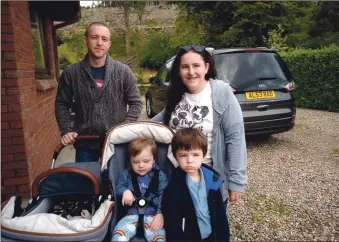  ?? ?? The MacLean family; dad Iain, mum Gillian, Max, in the pram, and Grayson and Noah outside their Brodick home.