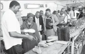  ??  ?? Millenium Footwear Director Stuart Simali stresses a point to the Minister of Small and Medium Enterprise­s and Cooperativ­e Developmen­t Sithembiso Nyoni during a tour of the company in Belmont yesterday.Looking on are the co-founder and Administra­tor...