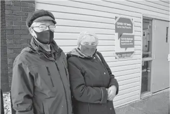  ?? JEREMY FRASER • CAPE BRETON POST ?? Jim and Sybil Ferrar of Sydney were among the local residents to take advantage of rapid COVID-19 testing at St. Theresa’s Parish hall in Sydney on Wednesday. Despite not having symptoms, the couple wanted to ensure they didn’t have the virus and decided to take the test.