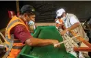  ?? Photograph: Pure Earth ?? Using a shaking table to separate gold from dirt and sand without using mercury.