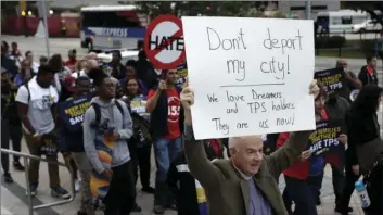  ??  ?? Frank Corbishley, of Coral Gables, Fla., marches in support of Deferred Action for Childhood Arrivals and Temporary Protected Status programs on Wednesday in Miami. AP PHOTO/LYNNE SLADKY