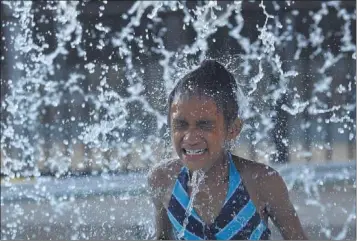  ?? PHOTOS BY CHRIS DESMOND/SPECIAL TO THE COMMERCIAL APPEAL ?? Eight-year- old Maryra Mims of Raleigh gets extra time in the pool at Ed Rice Community Center, as hours are extended for the Summer Night Lights program. The program is part of the Memphis Gun Down Safe 2013 initiative that will give kids more things...