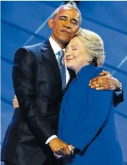  ??  ?? President Barack Obama hugs Democratic presidenti­al candidate Hillary Clinton after addressing the delegates during the Democratic National Convention in Philadelph­ia on Wednesday night.