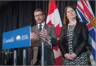  ?? CP PHOTO DARRYL DYCK ?? British Columbia Health Minister Terry Lake speaks Friday as federal Health Minister Jane Philpott listens after announcing the province and the federal government had reached an agreement on healthcare funding.