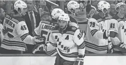  ?? GENE J. PUSKAR/AP ?? The Rangers’ Mika Zibanejad, bottom, returns to the bench after scoring the first of his three goals against the Penguins Friday in Pittsburgh.