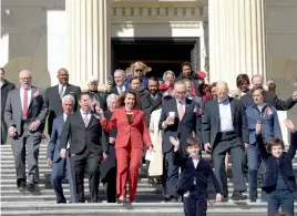  ?? — AP ?? House minority leader Nancy Pelosi of California, Senate minority leader Charles Schumer of New York, California governor Jerry Brown and other Democrats walk down the East Step on Capitol Hill on Wednesday for an event marking seven years since former...