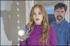  ?? 20TH CENTURY FOX ?? Isla Fisher and Zach Galifianak­is star in “Keeping Up With the Joneses.”