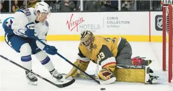  ?? JOHN LOCHER/AP ?? Lightning center Vladislav Namestniko­v attempts a shot on Golden Knights goaltender Adin Hill during the third period Saturday in Las Vegas.