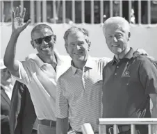  ?? BILL STREICHER/USA TODAY SPORTS ?? Former Presidents Barack Obama, left, George W. Bush and Bill Clinton, at The President’s Cup golf tournament in Jersey City, N.J., in 2017, agree on the importance of a vaccine for the coronaviru­s.