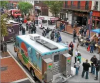  ?? DIGITAL FIRST MEDIA FILE PHOTO ?? Crowds walk up and down Bridge Street to find their favorite Food Truck during the annual food truck festival in Phoenixvil­le.