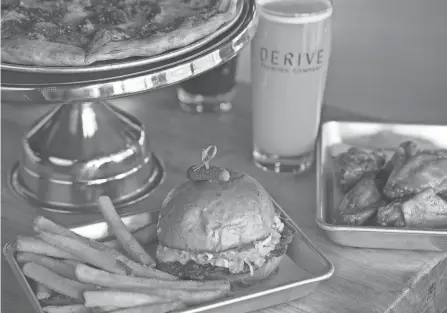  ?? TIM JOHNSON/COLUMBUS MONTHLY ?? A smashburge­r at Derive Brewing Co.