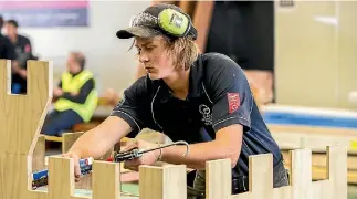  ?? PHOTO: DOUG FIELD/STUFF ?? Connor Dowling from Timaru won the apprentice challenge to build a castle playhouse in eight hours on Saturday.