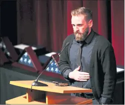  ??  ?? Veteran Zach Skiles, a graduate of the Pathway Home program, speaks at the memorial for the three Pathway employees who were killed March 9.