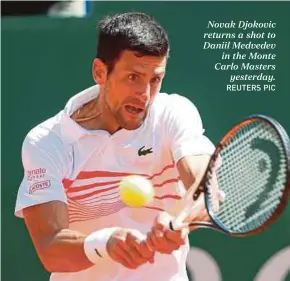  ?? REUTERS PIC ?? Novak Djokovic returns a shot to Daniil Medvedev in the Monte Carlo Masters yesterday.