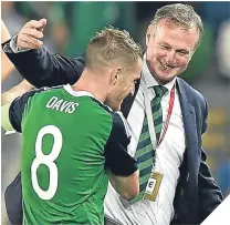  ??  ?? Northern Ireland boss Michael O’Neill with captain, Steven Davis.