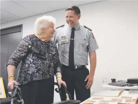  ?? Picture: Michael Nolan ?? DEDICATED VOLUNTEER: QAS West Moreton District Director Superinten­dent Drew Hebbron (right) thanks Toowoomba’s Enid Machin for her 50 years of service on the Ipswich Ambulance Committee.