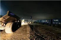  ?? ?? Aggregates are unloaded at the railhead south of Aylesbury in the early hours of March 2. HS2