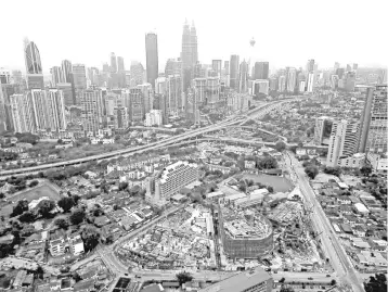  ??  ?? Photo shows a constructi­on area in Kuala Lumpur. Uncertaint­ies in the constructi­on sector is expected to continue in the immediate term as status of several mega infrastruc­ture projects and government policies have yet to be officially confirmed. — Bernama photo