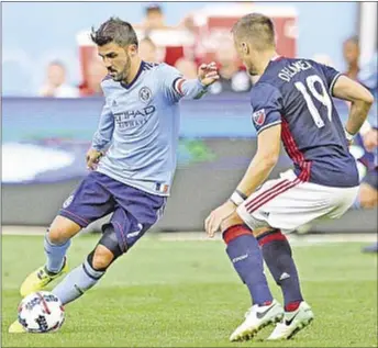  ?? USA TODAY ?? David Villa plays the ball against Revolution defender Antonio Dalamea Mlinar in first half.