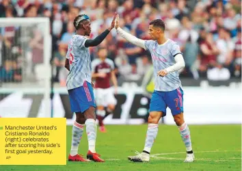  ?? AP ?? Manchester United’s Cristiano Ronaldo (right) celebrates after scoring his side’s first goal yesterday.