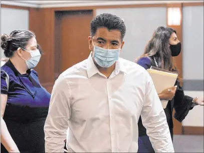  ?? Bizuayehu Tesfaye Las Vegas Review-journal @bizutesfay­e ?? Adolfo Orozco, owner of the Alpine Apartments who is charged with six counts of involuntar­y manslaught­er, leaves the courtroom after a hearing at the Regional Justice Center on Monday.