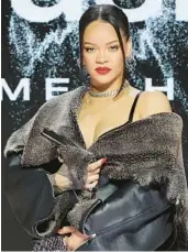  ?? MIKE COPPOLA/GETTY ?? Rihanna is seen Thursday at an event in which she discussed Sunday’s Super Bowl halftime show.