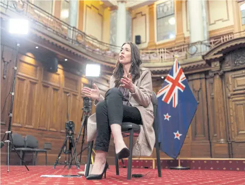  ?? AFP ?? New Zealand’s Prime Minister Jacinda Ardern speaks to a reporter during an interview about climate change at parliament in Wellington on Nov 4, 2022.
