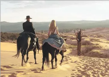  ?? HBO ?? THE MAN in Black (Ed Harris) and Dolores (Evan Rachel Wood) set off together in the “Westworld” finale.