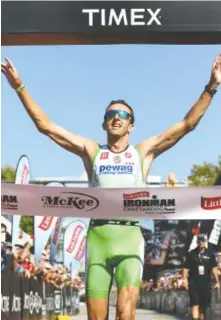  ?? STAFF FILE PHOTO ?? Marino Vanhoenack­er of Jabbeke, Belgium, raised his hands in victory when he won the 2016 Little Debbie Ironman Chattanoog­a triathlon in September 2016. Vanhoenack­er won overall with a time of 8:12:22.