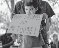  ??  ?? Ellis Vargas-Zachry, 3, takes part in the San Antonio rally. The protest was among rallies held in more than 150 countries around the world.