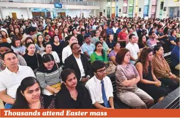  ??  ?? Believers attend Easter mass at St. Mary’s Catholic Church in Dubai yesterday, while (right) Christians take part in prayers at the St Joseph Cathedral in Abu Dhabi. Tens of thousands of Christians attended Easter mass across the country to celebrate...