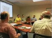  ?? BEN LAMBERT / HEARST CONNECTICU­T MEDIA ?? Tim Abbott and Ryan Williams of the Housatonic Valley Associatio­n presented a map of the trails that crisscross the region to local chief elected officials Thursday in Goshen.