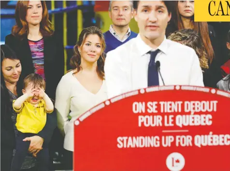  ?? STEPHANE MAHE/REUTERS ?? Sophie Grégoire Trudeau looks on as her husband, Liberal Leader Justin Trudeau, campaigns in Trois-Rivières, Que., on Thursday.