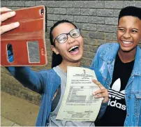  ?? Picture: EUGENE COETZEE ?? SELFIE TIME: St Thomas High School’s Destiny van Rooyen, 17, left, and Bahle Sidzumo, 18, celebrate their matric results with a selfie