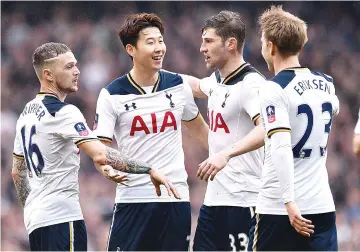  ?? - AFP photo ?? Tottenham Hotspur’s South Korean striker Son Heung-Min (2L) celebrates scoring his team’s second goal during the English FA Cup quarter-final football match between Tottenham Hotspur and Millwall at White Hart Lane in London, on March 12, 2017.