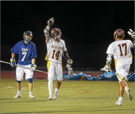  ?? PETE BANNAN — DIGITAL FIRST MEDIA ?? Brendan Harman of Avon Grove celebrates after scoring in the third quarter against Downingtow­n East in their Ches-Mont League boys lacrosse game Thursday.