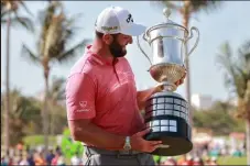  ?? HECTOR VIVAS
Getty Images ?? Jon Rahm of Spain poses with the Mexico Open champions trophy after the final round of tournament on Sunday in Puerto Vallarta, Jalisco.