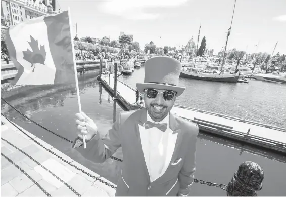  ?? PHOTOS BY DARREN STONE, TIMES COLONIST ?? Sartoriall­y splendid Michael Khan celebrates Canada’s 151th birthday Sunday at the Inner Harbour: “It’s the best place on Earth.”